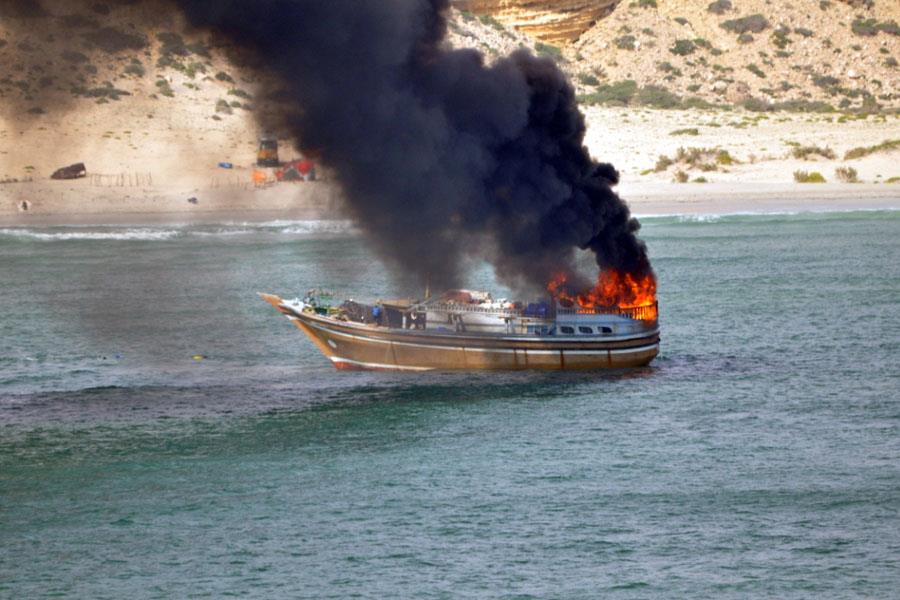 Burning Dhow in Gunfight With Dutch Warship - Photo; NL MoD Burning Dhow in Gunfight With Dutch Warship - Photo; NL MoD
