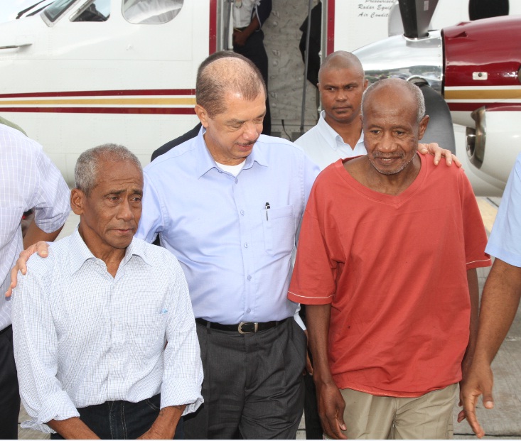 Rolly Tambara and Marc Songoire with President Michel following release Rolly Tambara and Marc Songoire with President Michel following release